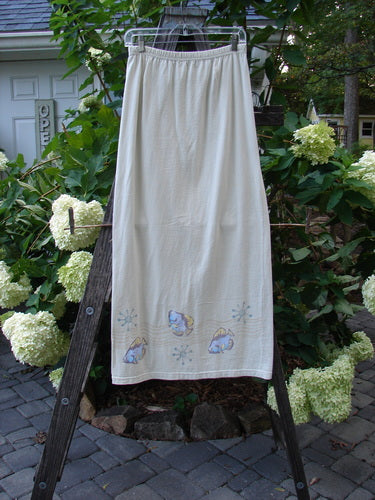 1999 Straight Skirt Fish School Dust Size 0 displayed on a wooden ladder, showcasing the full elastic waistband and fish-themed hem design, part of Bluefishfinder.com's vintage collection.