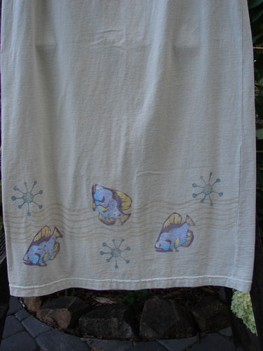 1999 Straight Skirt Fish School Dust Size 0 hanging on a clothesline, showcasing its organic cotton material and fish-themed hem design.