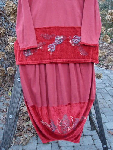 1996 Velvet Arrowhead Sofia Duo Pomegranate Size 1: A red dress with a gold design, ladder, and curtain. Made from stretch velvet and cotton jersey. Accented V neckline, cuffs, and drop waistline. Bust 52, waist 52, hips 52, length 32. Bell-shaped skirt with accent hem, rear kick vent, and pegged lower shape. Waist 28-38, hips 60, length 40.