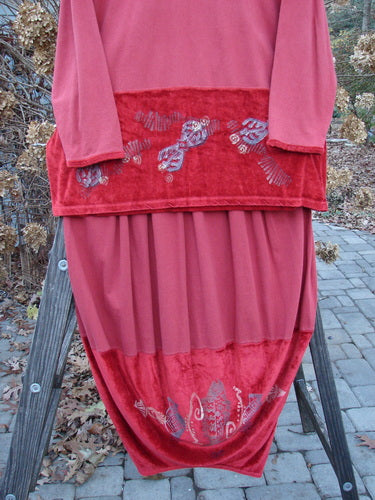 1996 Velvet Arrowhead Sofia Duo Pomegranate Size 1, featuring a red and gold design, showcased in perfect condition. This pullover and skirt set is from the 1996 Holiday Winter Collection.