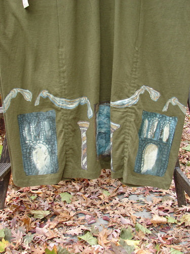 1993 NWT Holiday Button Maker's Dress Roman Goddess Olive OSFA featuring a deep V neckline, vintage buttons at the waist, and lower hem drawcords, showcasing a Roman goddess painting.