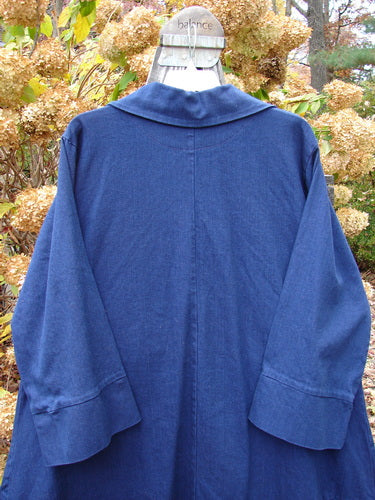 Barclay Denim Triangular Collar Coat Unpainted Royal Size 2 displayed on a mannequin, featuring a full button front, A-line shape, banded lower sleeves, and diagonal paneled pockets in heavyweight denim twill.