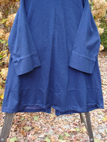 Barclay Denim Triangular Collar Coat Unpainted Royal Size 2 on wooden stand, showcasing full button front and diagonal paneled pockets, part of Bluefishfinder's vintage-inspired collection.