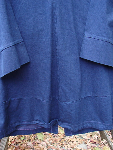Barclay Denim Triangular Collar Coat Unpainted Royal Size 2, close-up view showing the full button front, A-line shape, banded lower sleeves, and diagonal paneled pockets in heavyweight denim twill.