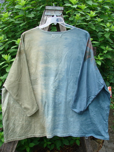 Barclay Cotton Lycra Writer's Pocket Sweatshirt Metallic Botanical Mottled Day Fog OSFA displayed on a clothes hanger outdoors, highlighting its seamless front, dynamic metallic botanical art, and dual drop flop pockets.