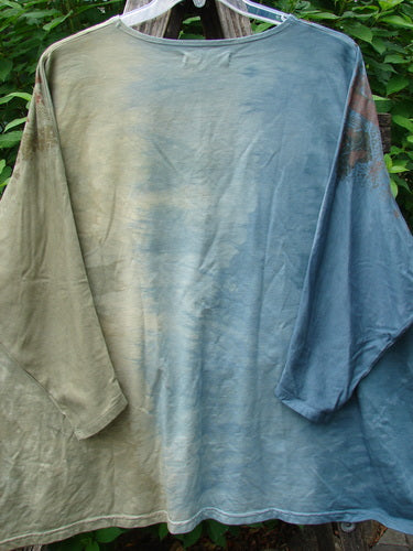 Barclay Cotton Lycra Writer's Pocket Sweatshirt Metallic Botanical Mottled Day Fog OSFA displayed on a hanger, showcasing its rounded neckline, dual pockets, seamless design, and unique metallic botanical art.