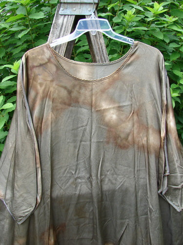 Barclay Viscose Vitreous High Low Tunic Botanicals Mottled Copper Bronze OSFA with a rounded neckline and three-quarter dolman sleeves, displayed on a hanger, showcasing its generous shape and exterior stitchery.