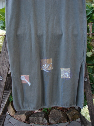 2001 Slim Skirt Junk Drawer Kelp Size 0, featuring organic cotton with artistic paint accents, a flattering waistline, side vents, and a slightly pegged hemline.