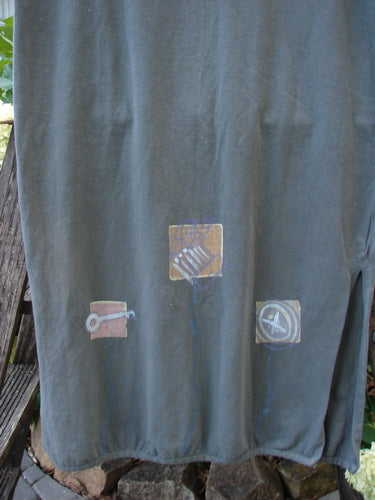 2001 Slim Skirt Junk Drawer Kelp Size 0 with artistic drawings, featuring a flattering waistline, side vents, mid bell shape, pegged hemline, and a comfortable, stress-free fit.