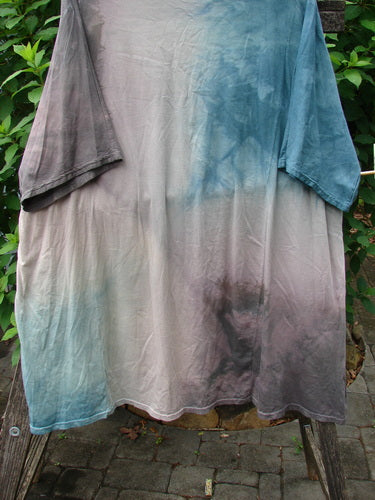 Barclay Art Tee Fern Garden Mottled Pure Dawn OSFA on a rack, showcasing its tunic length, drop shoulders, loose three-quarter sleeves, and unique hemline, embodying artistic vintage fashion from Bluefishfinder.com.