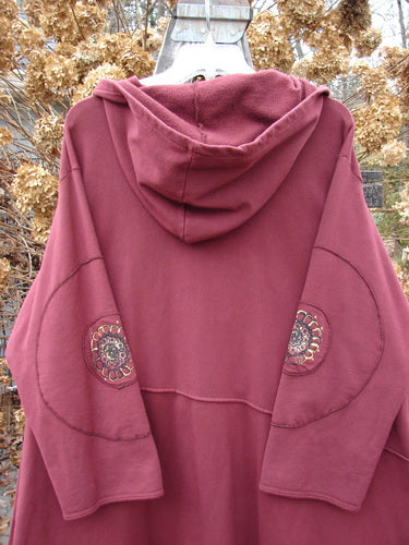 Barclay Patched Interlock Hooded Curve Coat Red Wine Size 2 features a cozy hood, giant circle sleeve patches, S-shaped button line, exterior stitching, A-line flair, varying hemline, and deep pockets.