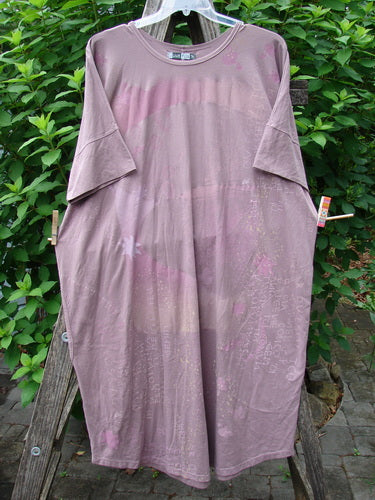 Barclay Long Tee Tie Back Dress Star & Moon Mottled Dark Mauve OSFA features a rounded neckline, dual pockets, drawcord back, and seamless bodice, showcasing the Blue Fish Clothing’s creative and unique design.