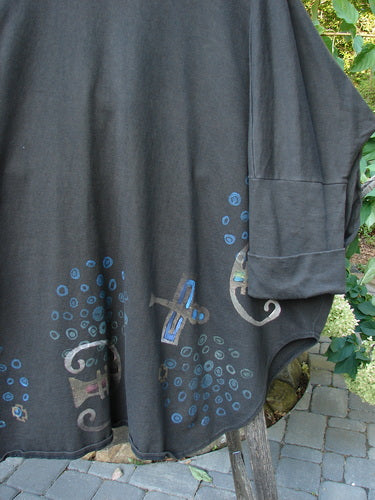 1996 Reprocessed Phoenician Jacket Abstract Travel Obsidian OSFA: Black shirt-like jacket with blue designs, featuring oversized buttons, dolman sleeves, deep V-neckline, and side pockets, showcasing a unique abstract travel theme.
