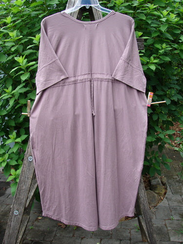 Barclay Long Tee Tie Back Dress Star & Moon Mottled Dark Mauve OSFA featuring a seamless front and back bodice, drawcord back, short cuffed sleeves, and inseam pockets, displayed close-up.
