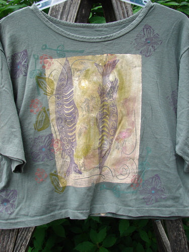 1991 Short Sleeved Crop Tee Fish Flower Olive Drab OSFA featuring vintage double fish and continuous flower design on mid-weight cotton, highlighting a rolled neckline and slight rear fade, capturing Blue Fish's timeless style.