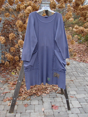 Barclay Patched Thermal Drop Pocket Dress in Royal Blue on a clothes rack, featuring drop shoulders, oversized wrap-around pockets, and hand-painted patches.