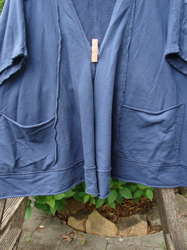 Barclay Photogram Open Front Jacket Rear Daisy Deep Navy OSFA features three-quarter sleeves, an open front, and angular hem. The jacket's unique pattern and design align with Bluefishfinder.com's vintage aesthetic.