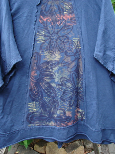 Close-up of the Barclay Photogram Open Front Jacket Rear Daisy Deep Navy OSFA, showcasing its angular hem, wide three-quarter sleeves, and distinctive floral pattern on heavy-weight organic French terry fabric.