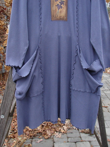 Barclay Patched Thermal Drop Pocket Dress Tiny Leaf Vine Royal Blue Size 1 on a wooden stand, showcasing its deep neckline, oversized pockets, and hand-painted patches.