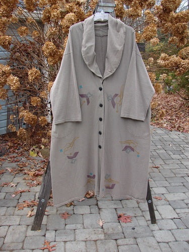1994 Carriage Coat with Ric Rack design, made from reprocessed cotton. Oversized with wide collar, deep pockets, and vintage buttons.