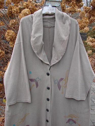 1994 Reprocessed Carriage Coat Ric Rack Raku OSFA featuring a billowy collar worn as a scarf or shawl, oversized buttons, deep side pockets, and a varying hemline.