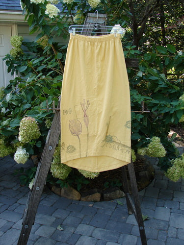1998 Botanicals Corolla Skirt Digitalis Sundial Size 0 on a rack, showcasing its unique upward curved front and longer rounded back design.