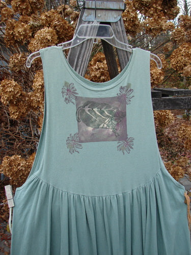 1994 Side Button Jumper Butterfly Garden River Size 1 displayed on a clothes hanger, featuring a rounded neckline, deeper arm openings, and a curved drop waist with gathered lower fabric.