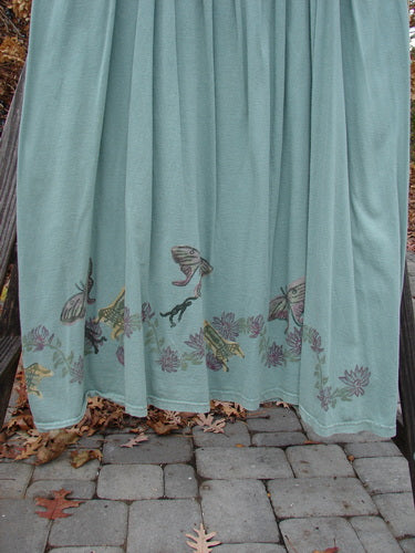 1994 Side Button Jumper Butterfly Garden River Size 1, featuring a blue curtain with bird pattern, rounded neckline, deep arm openings, side waist buttons, and gathered lower fabric.