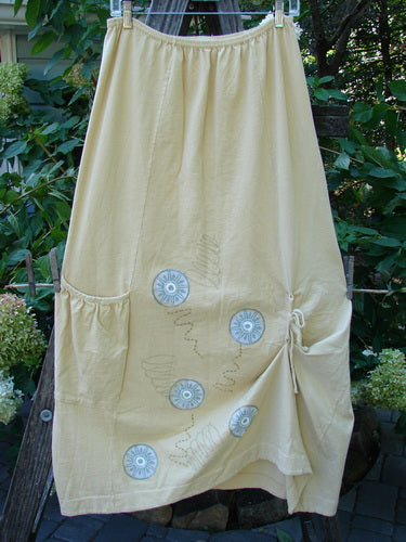 2000 Side Pocket Skirt Pinwheel Plantain Size 0 features a full elastic waistline, side pocket, and vertical panels with pinwheel design for a stylish, flowing look.