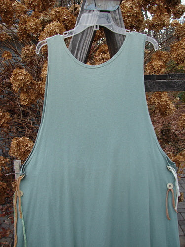 1994 Side Button Jumper Butterfly Garden River Size 1 displayed on a clothes rack, featuring a rounded neckline, deeper arm openings, and side buttons for an apron attachment.