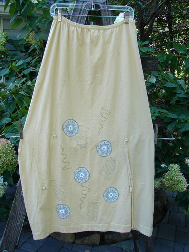 2000 Side Pocket Skirt Pinwheel Plantain Size 0, featuring an elastic waist, side pocket, vertical panels, and pinwheel design on organic cotton.
