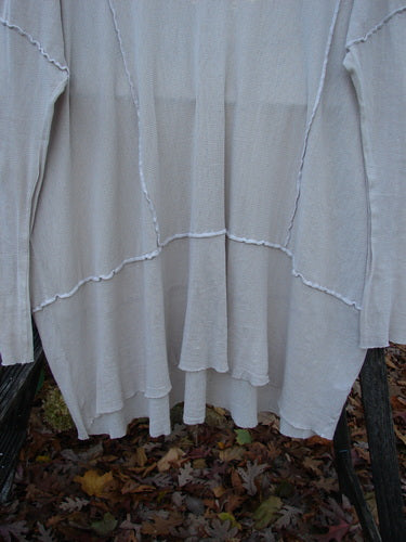 Barclay Cotton Mesh Exterior Stitch Sectional Overtop Unpainted Pink Cloud Size 2 features a softly textured cotton mesh, wide neckline, long sleeves, exterior stitching, sectional panels, and a unique upper rear silken patch.