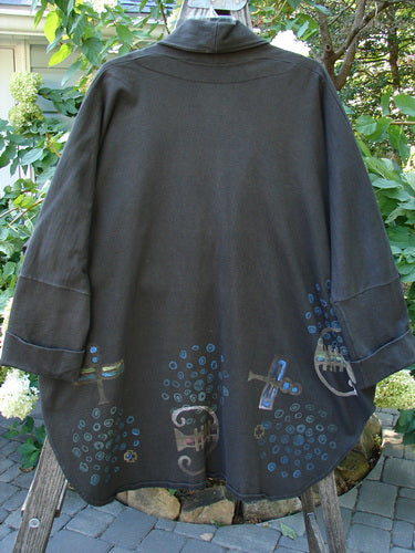 1996 Reprocessed Phoenician Jacket Abstract Travel Obsidian OSFA featuring a black design with a painted blue abstract pattern, Dolman sleeves, deep V neckline, oversized button, and side pockets.