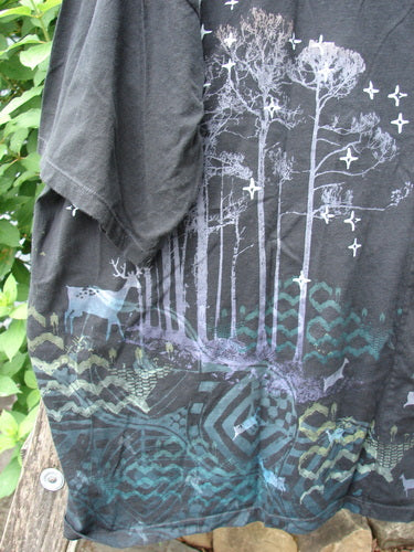 The Barclay Center Seam Wide Line Tee Tree Moon Star Black OSFA features a unique tree and moon star design, with a boxy shape, drop shoulders, and a vertical center seam, embodying BlueFishFinder's creative spirit.
