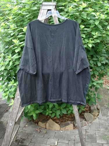 Barclay Center Seam Wide Line Tee Tree Moon Star Black OSFA displayed on a clothesline, showcasing its boxy fit, rounded ribbed neckline, and distinctive tree and moon star design.