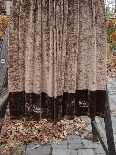 Image alt text: 1997 Velvet Sanskrit Cosmos Duo Mandorla OSFA Size 2: A draped brown curtain with a pile of leaves on the ground.