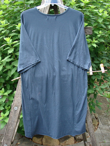 Barclay NWT Tournesol Slim Tunic Turn Moon Navy OSFA, displayed on a clothes rack, featuring a mid-length design with drop shoulders, loose three-quarter sleeves, and a rounded neckline.