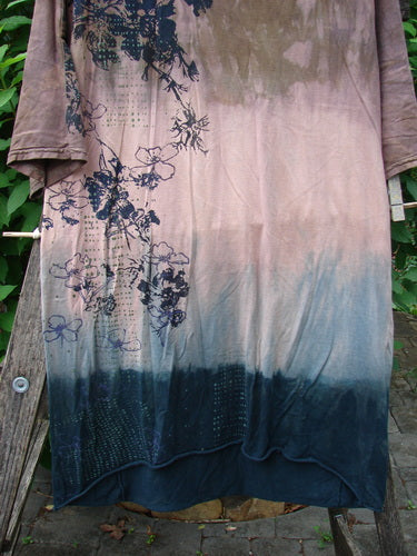 Barclay Tournesol Slim Tunic Dogwood Mottled Dusk OSFA featuring a floral pattern, drop shoulders, loose three-quarter sleeves, rounded neckline, and varying hemline, embodying creative individuality from Bluefishfinder.com.