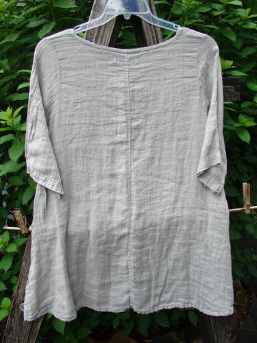 Barclay NWT Linen Springtime Top Unpainted Cloud Size 0 on a hanger, showcasing its lightweight linen fabric, rounded neckline, A-line shape, and almost three-quarter sleeves, embodying Bluefishfinder.com's vintage-inspired style.