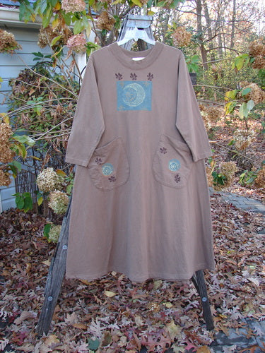 1997 Persian Dress Celtic Moon Mandorla Altered Size 0, showcasing a mid-length A-line silhouette with Celtic moon design, offset painted pockets, ribbed neckline, and drawcord back, crafted from organic cotton.
