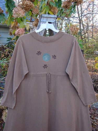 1997 Persian Dress Celtic Moon Mandorla Altered Size 0 displayed on a hanger, featuring a sweeping A-line shape, ribbed neckline, and offset painted pockets with Celtic moon designs.