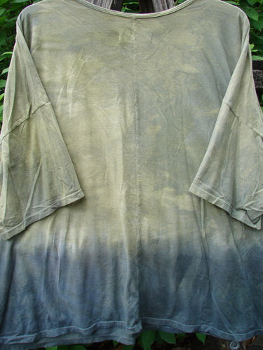Barclay Wide Line Tee Primitive Circle Path Mottled Olive Grey OSFA, showcasing a seamless design with a tie-dye pattern and generous boxy shape, featuring a rounded ribbed neckline and significant drop shoulders.