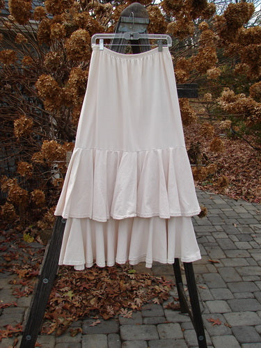 1993 Two Story Skirt on clothes rack, featuring tear layers and wide lower sweep. Perfect condition, made of mid-weight cotton jersey. Size 2.