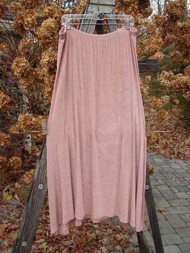 1999 Acetate Lycra Camillia Acetate Duo Swan Size 1 2, featuring a pink skirt with a varying hemline and full elastic waist, displayed on a wooden ladder.