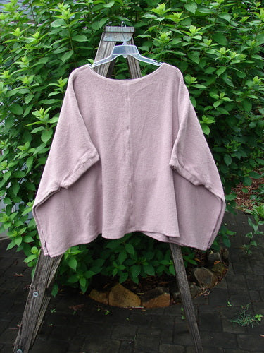 Barclay Celtic Moss Patched Poncho Single Flowerpot Mallow OSFA displayed on a wooden stand, showcasing its open sides, gathered lower sleeves, and textured Sherpa fleece from Bluefishfinder.com's winter collection.