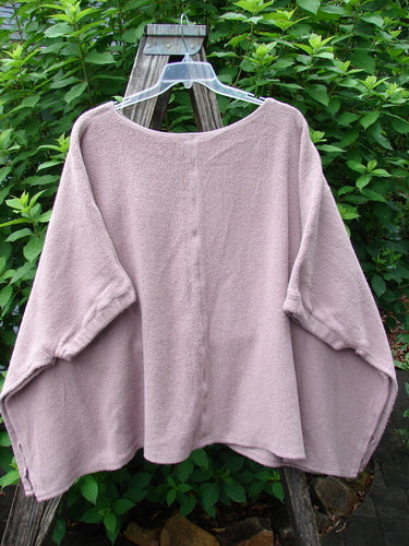 Barclay Celtic Moss Patched Poncho Single Flowerpot Mallow OSFA draped on a swinger, showcasing its open sides, gathered sleeves, and dense textured fabric, reflecting Bluefishfinder's vintage, expressive style.