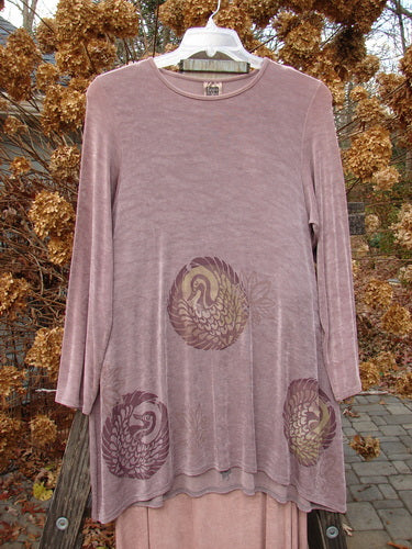 1999 Acetate Lycra Camillia Acetate Duo Swan Size 1 2 featuring a long-sleeved pink dress with swan patterns, showcasing a swingy A-lined shape and a significant varying hemline.