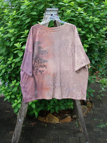 Barclay Center Seam Wide Line Tee Tree Moons Mottled Sunset OSFA displayed on a swinger, featuring a tree motif, rounded neckline, drop shoulders, and vertical center seam, embodying BlueFishFinder's vintage, expressive style.