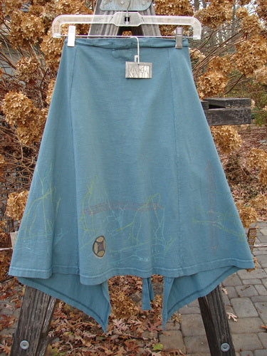 2000 NWT Grid Patch Wrap Skirt in Puddle. Organic cotton skirt with long belt, cross-stitched accents, and sectional panels. Versatile as a mini skirt or over straight bottoms. Length: 27" (long) / 23" (short), Width: 56".