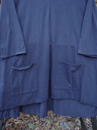Barclay NWT Hi Low Pocket Tunic Top Unpainted Ink Size 2, showcasing a rounded neckline, varying hemline, and double front pockets, displayed in a close-up with visible fabric details.